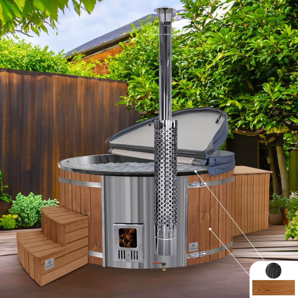 A round hot tub with marble black acrylic insert, ThermoWood cladding, and integrated AISI 316 stainless steel heater, set in an outdoor setting with surrounding greenery.