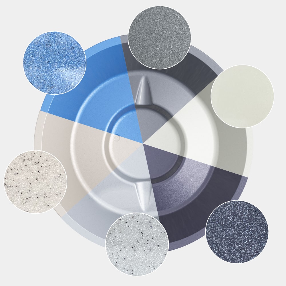 Draufsicht auf eine runde Farbpalette mit sieben strukturierten Farb- oder Beschichtungsmustern in neutralen und blauen Tönen