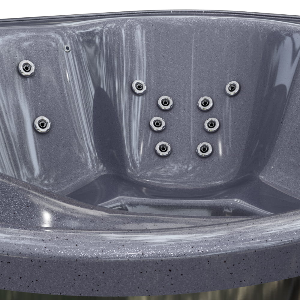 Close-up of a grey hot tub with hydro massage jets.